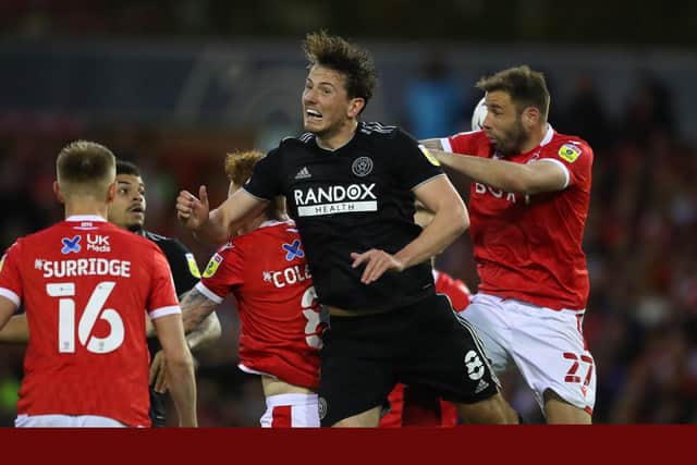 Steve Cook of Nottingham Forest with Sander Berge of Sheffield United during Tuesday's breathless match at the City Ground: Simon Bellis / Sportimage