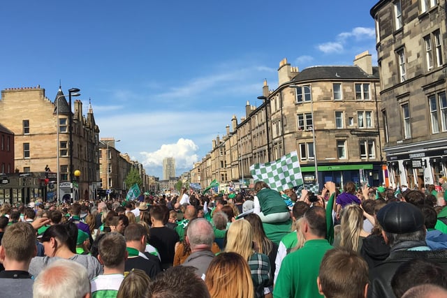 Hibs fans line Leith Walk as the victory parade makes its way to Leith Links