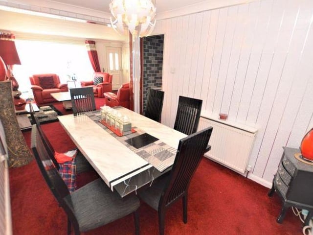 The living room leads directly into the dining room, where you and your family can enjoy meals together