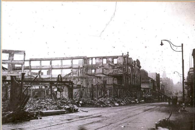 Atkinsons (left) after the blitz. The shot is taken looking up The Moor towards the Town Hall.