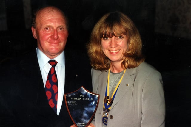 Ian Charles received Hope Valley Rotary Club's President's Shield for Excellence from Jane Weightmore in 2000