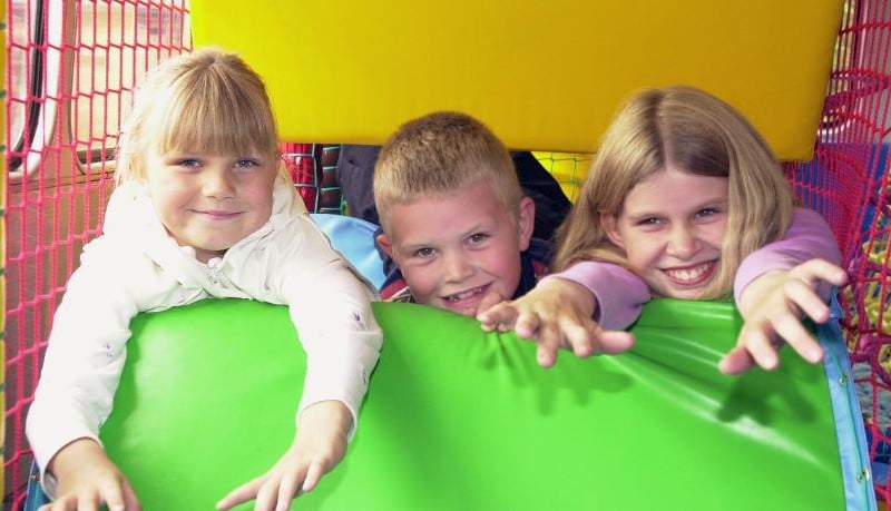 The Fun Bus cam to Rossington Hall School's Fayre in 2000. Victoria, Craig and Becky Brookes from Armthorpe are photographed enjoying the day.