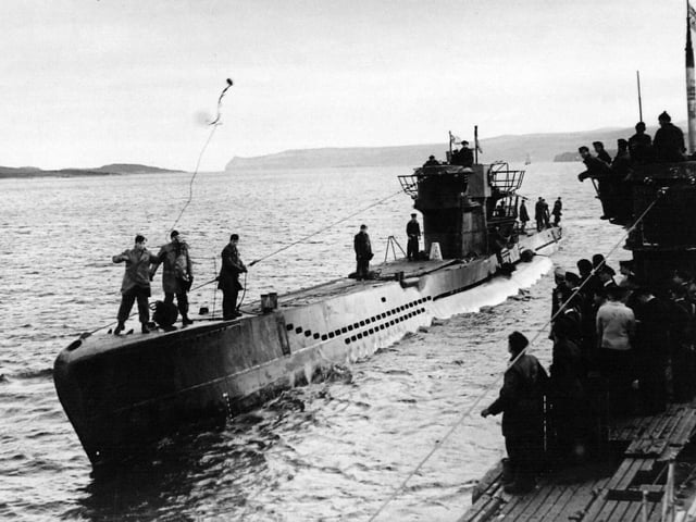 German U-Boat U236  (left) similar to U-Boat U564. U564 was photographed in action during the 1940's. The pictures were discovered in a attic and have been donated to the Royal Navy Submarine Museum Gosport.
