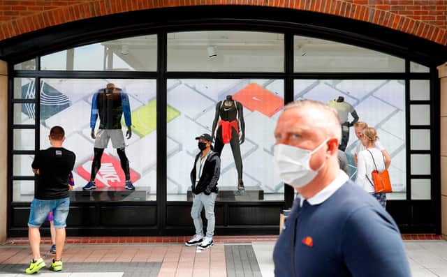Shoppers wearing face masks and coverings at Gunwharf Quays. Picture: ADRIAN DENNIS/AFP via Getty Images