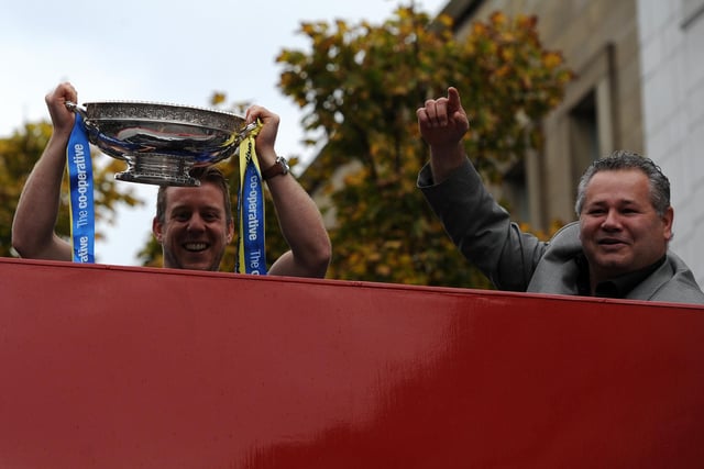 Stewart Sanderson and Carl Hall are pictured on the open top bus at the Dons' celebration parade.