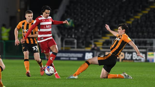 Reece James is challenged by Hull's Jacob Greaves