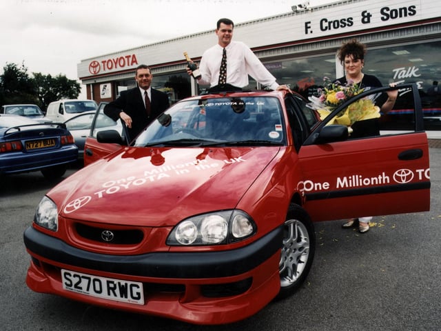 Toyota (GB) Ltd sells its one millionth passenger car in the UK. Pictured (right to left) in 1998 were proud owners Tracey and John McAllister and Kevin Orridge, Sales Manager of supplying dealers, F.Cross & Sons, Doncaster, South Yorkshire.