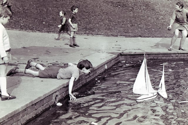 Children making the most of the sunshine at Firth Park in 1969 as they play in the boat lake.