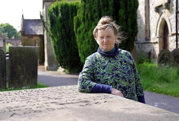Ruth at the grave of Catherine Mompesson, who was the wife of the vicar at the time of the plague outbreak (photo: 5 Broadcasting Limited/Voltage TV)