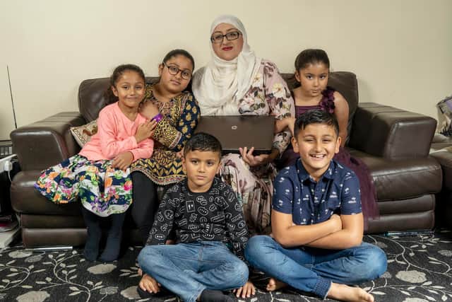 Salma Akhtar pictured with her children Haadiya, Dayyan, Yusra, Ruqayyah and Abdul-Hannan, were the first family to receive a laptop as part of the Laptops for Kids campaign. Picture: Scott Merrylees.