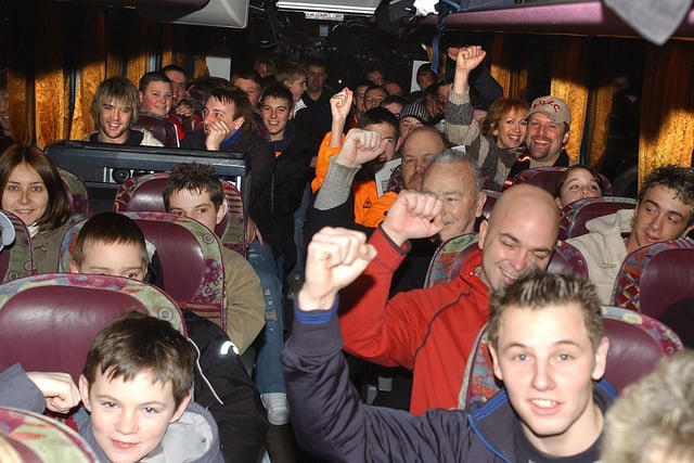 United fans set off on the coach for their FA Cup tie with Arsenal in February 2005
