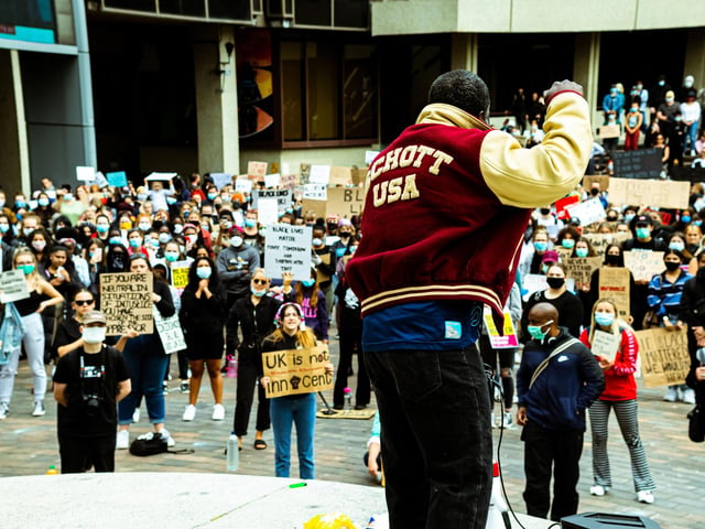 Addressing the crowd, the speaker described himself as a 'a hard-working African'