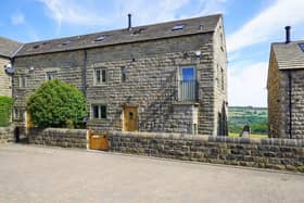 The stone-built house in Stocksbridge, Sheffield, has attractive wooden beams and oak flooring