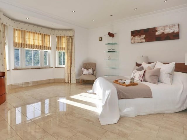 The main bedroom is the master in every way. It boasts a high ceiling, large bay-window to the front, well-equipped dressing area and plenty of wardrobe space, shelves and drawers.