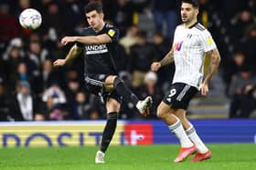 John Egan of Sheffield United clears under pressure from Aleksandar Mitrovic of Fulham  during the Sky Bet Championship match at Craven Cottage, London: David Klein / Sportimage
