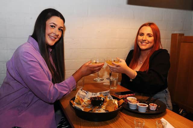 DAy 1 in Level 2, and Behind The Wall was a busy place - Nina Johnston 19, Larbert and Stephanie Lusk 19, Bonnybridge, enjoy their meal (Pic: Michael Gillen)