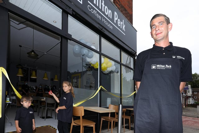 Milton Perk Coffee House has opened up in Milton Road, Southsea. Pictured is owner Shaun Carter with his children, Theo, 2, and Olivia, 8, who cut the ribbon. Picture: Chris Moorhouse (jpns 190621-05)