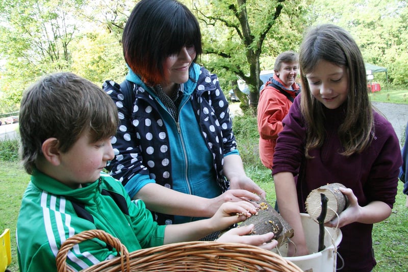 Roscoe Forder-McGee, , of Chesterfield, his mother Sally and friend Jenny Shaw fill bird feeders with seed at the Black Rocks Woodland Festival in 2010.
