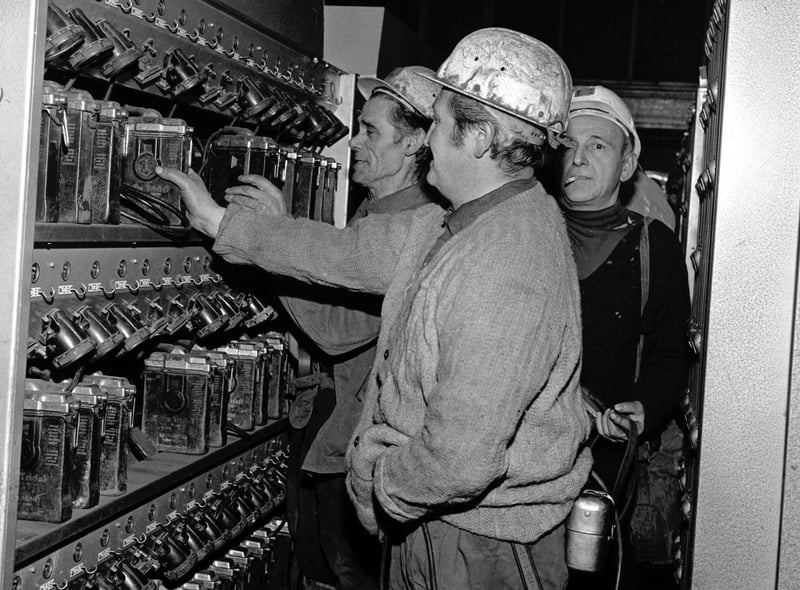 Miners at Monktonhall colliery collect their lamps from the lamphouse on one of the first shifts after the strike ended.