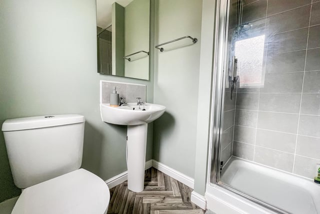 With a walk-in shower, this bathroom is thoroughly modern.