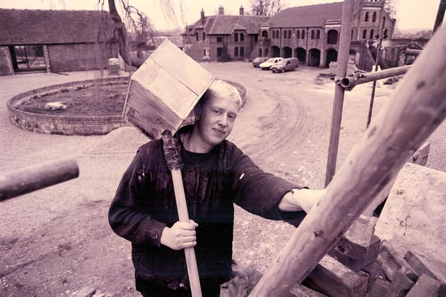 Labourer Mark Jackson from Funtington carries bricks to the team restoring the old Home Farm buildings at Cams Hall, Fareham in January 1993. The News PP116