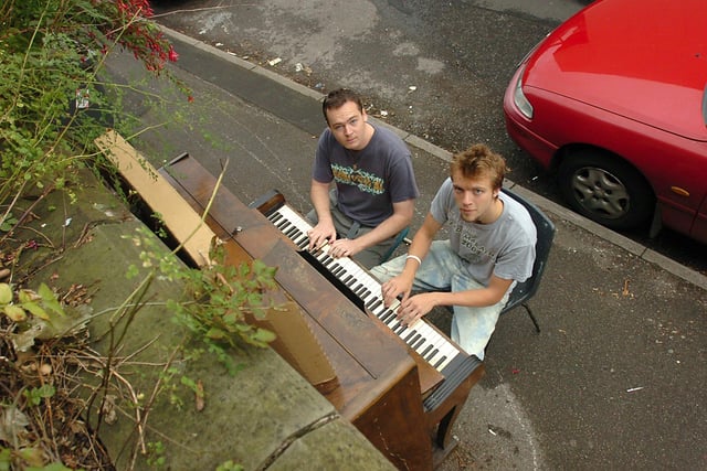 Hugh Jones left and Doug Pearman with their "street piano" on Sharrowvale Road in 2005