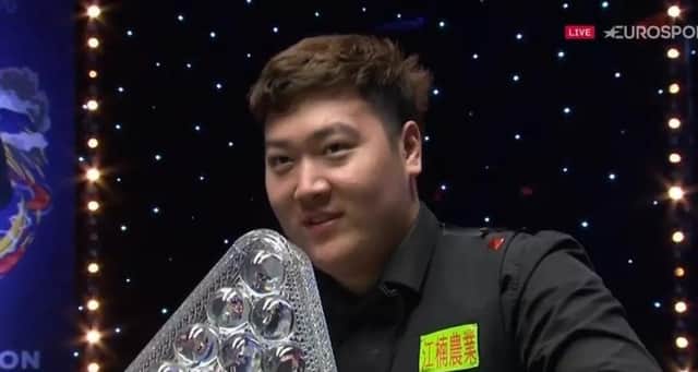 TROPHY TIME: New Masters champion Yan Bingtao with the trophy after pocketing a £250,000 cheque. Picture: Sportsbeat