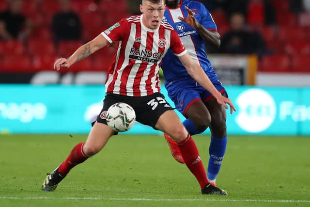 Kacper Lopata of Sheffield United tussles with Gime Toure of Carlisle during the Carabao Cup match at Bramall Lane, Sheffield, in August: Simon Bellis / Sportimage