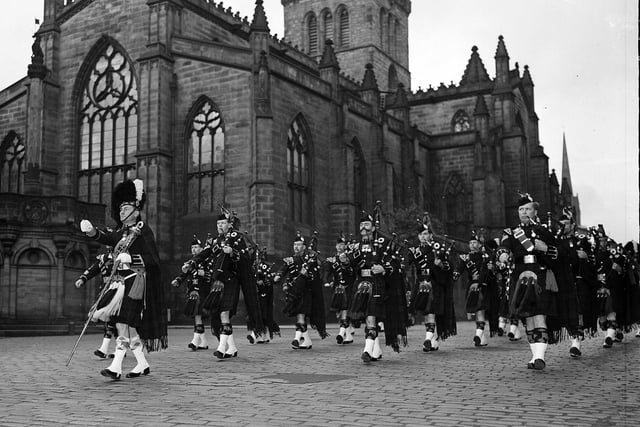 The General Assembly Guard of Honour, consisting of the Argyll and Sutherland Highlanders, march past St Giles' Cathedral on their way to Holyrood in May 1963.