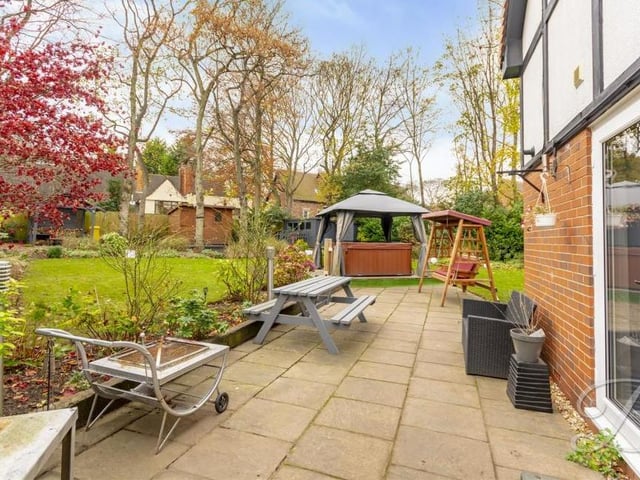 Stepping outside via the French doors, you will find this delightful seating area. The perfect spot to relax and enjoy the garden, especially during the summer.