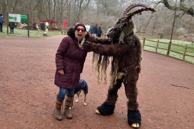 An unsuspecting dog walker encounters one of the terrifying Krampus creatures during the Spirits of the Forest and Wassailing weekend at Sherwood Forest