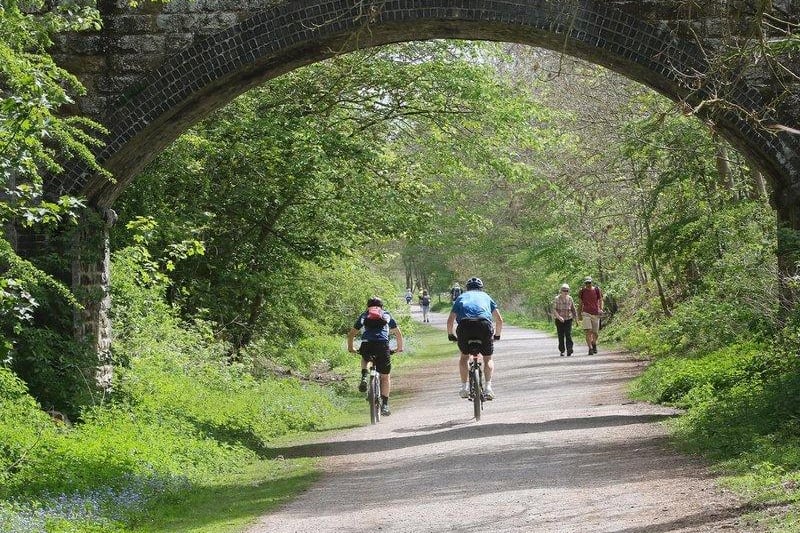 Dad and his family can enjoy picturesque scenery by cycling along the traffic-free Monsal Trail.