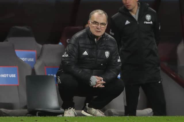Head coach Marcelo Bielsa crouches on the touchline during the English Premier League football match between Aston Villa and Leeds United at Villa Park