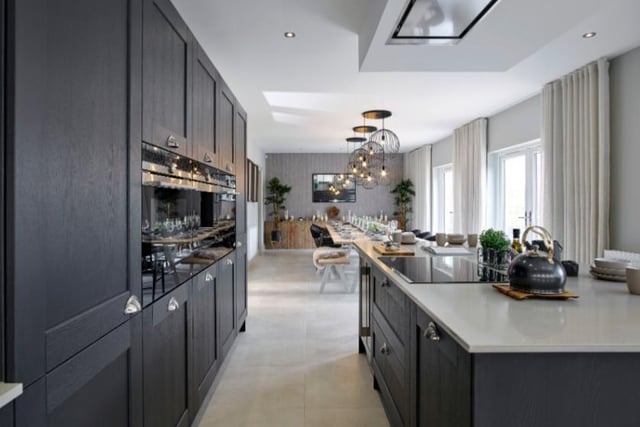 The kitchen features a stunning island which hosts a stylish Siemens hob can also seat a further six people making this home ideal for entertaining on a large scale.
Image by Robertson Homes.