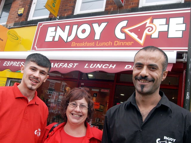 Enjoy Cafe owner Taylan Oztoprak, right and manager Diyar Tasdelen pictured with one of their regular customers Jenny Dunning outside their Sutton diner in 2009