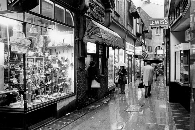 A rainy day for shoppers enjoying the many shops on Chapel Walk, Sheffield, November 18, 1974