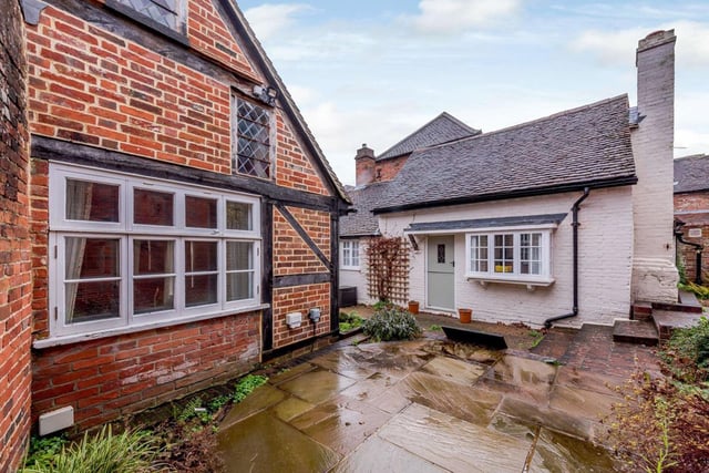 To the rear there is a pleasant courtyard garden with a raised terrace and a pond. The outside space has well stocked beds and provides a private area for alfresco dining.