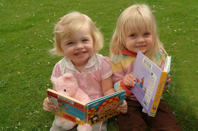 Picnic and storytelling for children in the memorial gardens - in conjunction with library services and Surestart in 2007
Picture: L-R: Sophie Spencer, (2) & Molly Hind, (3)
