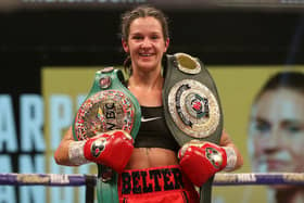Terri Harper celebrates her win with her belts: Photo: Mark Robinson/Matchroom Boxing
