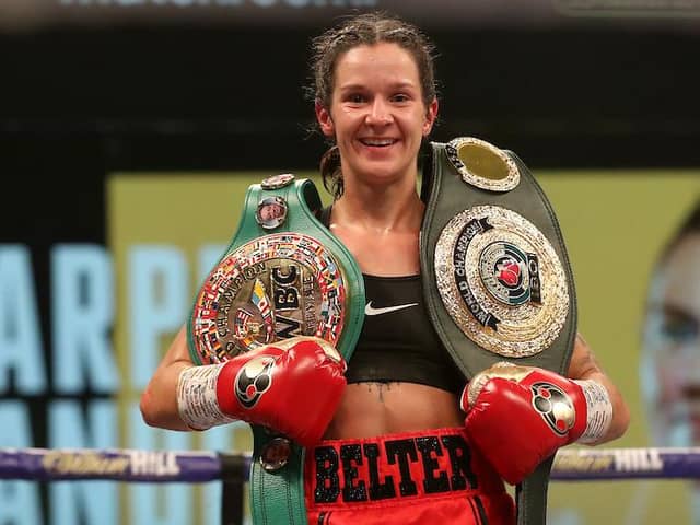 Terri Harper celebrates her win with her belts: Photo: Mark Robinson/Matchroom Boxing