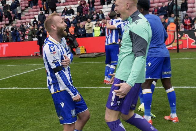 Owls celebrate staying up after a 2-0 win at the Stadium of Light  Barry Bannan and Cameron Dawson    Pic Steve Ellis