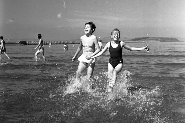 Two girls playing in the water at Cramond Edinburgh in August 1970.
