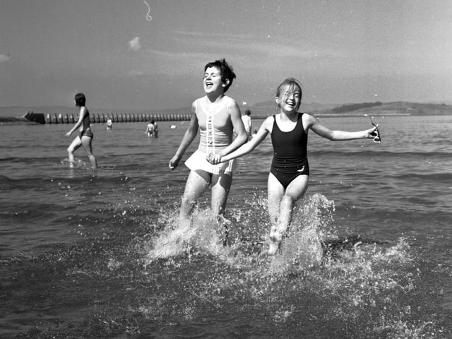 Two girls playing in the water at Cramond Edinburgh in August 1970.