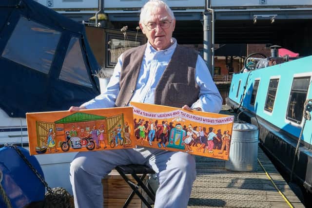 Artist Joe Scarborough working on his latest projects on his boat in Sheffield Canal Basin.