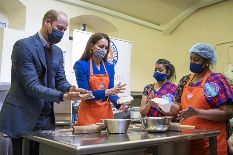 Prince William and Kate prepare meals with representatives of Sikh Sanjog, a Sikh community group, which will be distributed to vulnerable families across Edinburgh, in the cafe kitchen at the Palace of Holyroodhouse, Edinburgh on 24 May during their tour of Scotland.