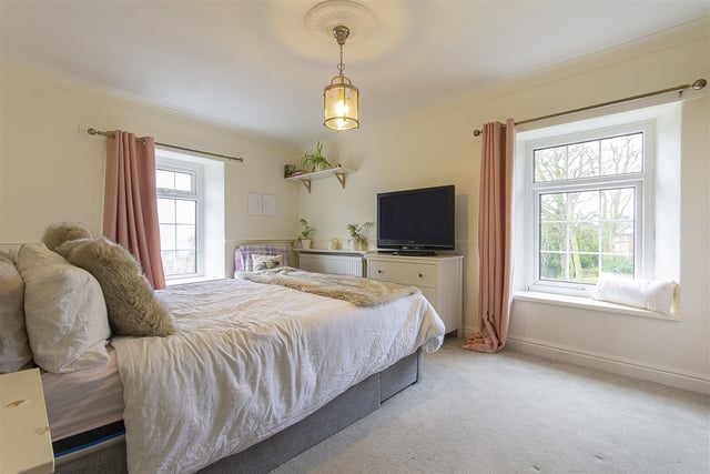 This large bedroom has two lovely window which are deep enough to use as a window seat.