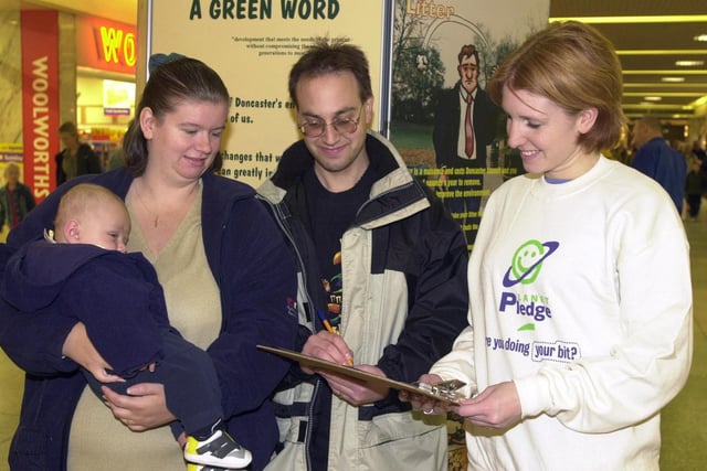 Helen Grant, of the Tidy Britain Group (right), chats to Amanda and David Chojnowski, of Hexthorpe, seen here with their four and a half month old son Joshua. Sustainability-More Than Just a Green Word, opened in the Frenchgate Centre  in 2000