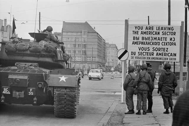 American tanks and troops at Checkpoint Charlie, a crossing point in the Berlin Wall between the American and Soviet sectors of the city at the junction of Friedrichstrasse, Zimmerstrasse and Mauerstrasse: Getty Images