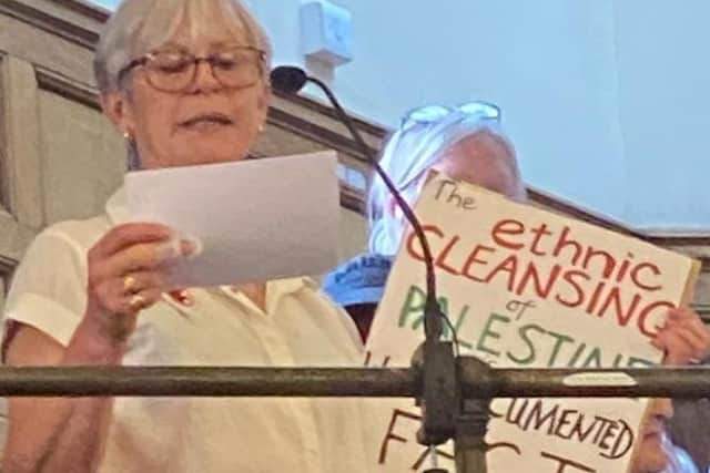 Dr Julie Pearn , chair of Sheffield Labour Friends of Palestine, asking her question about twinning Sheffield with the city of Nablus at a meeting of Sheffield City Council on September 6. Her placard says "the ethnic cleansing of Palestinians is a documented fact". Picture: Shaffaq Mohammed
