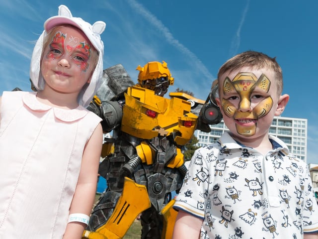 (L-R) Libby Friend (5yrs) and Jacob O'Brien (4yrs) from Plymouth meet 'Bumbblebee' during Victorious Festival 2019.